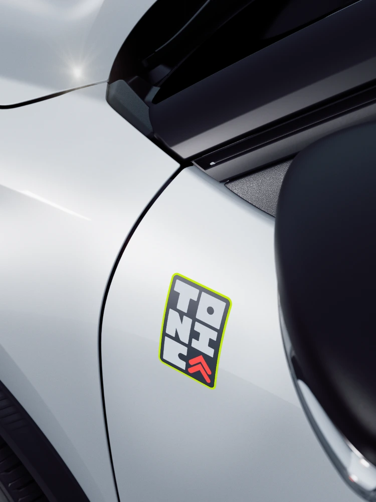 Detail voorzijde Citroën ë‑C3 TONIC limited edition elektrische stadsauto met kenmerkende grille en color clips