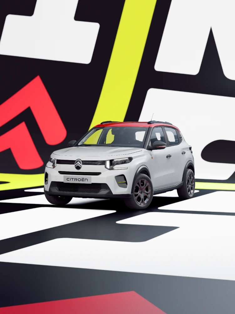 3/4-aanzicht voorzijde Citroën ë‑C3 TONIC limited edition elektrische stadsauto met dynamische houding en grafische styling