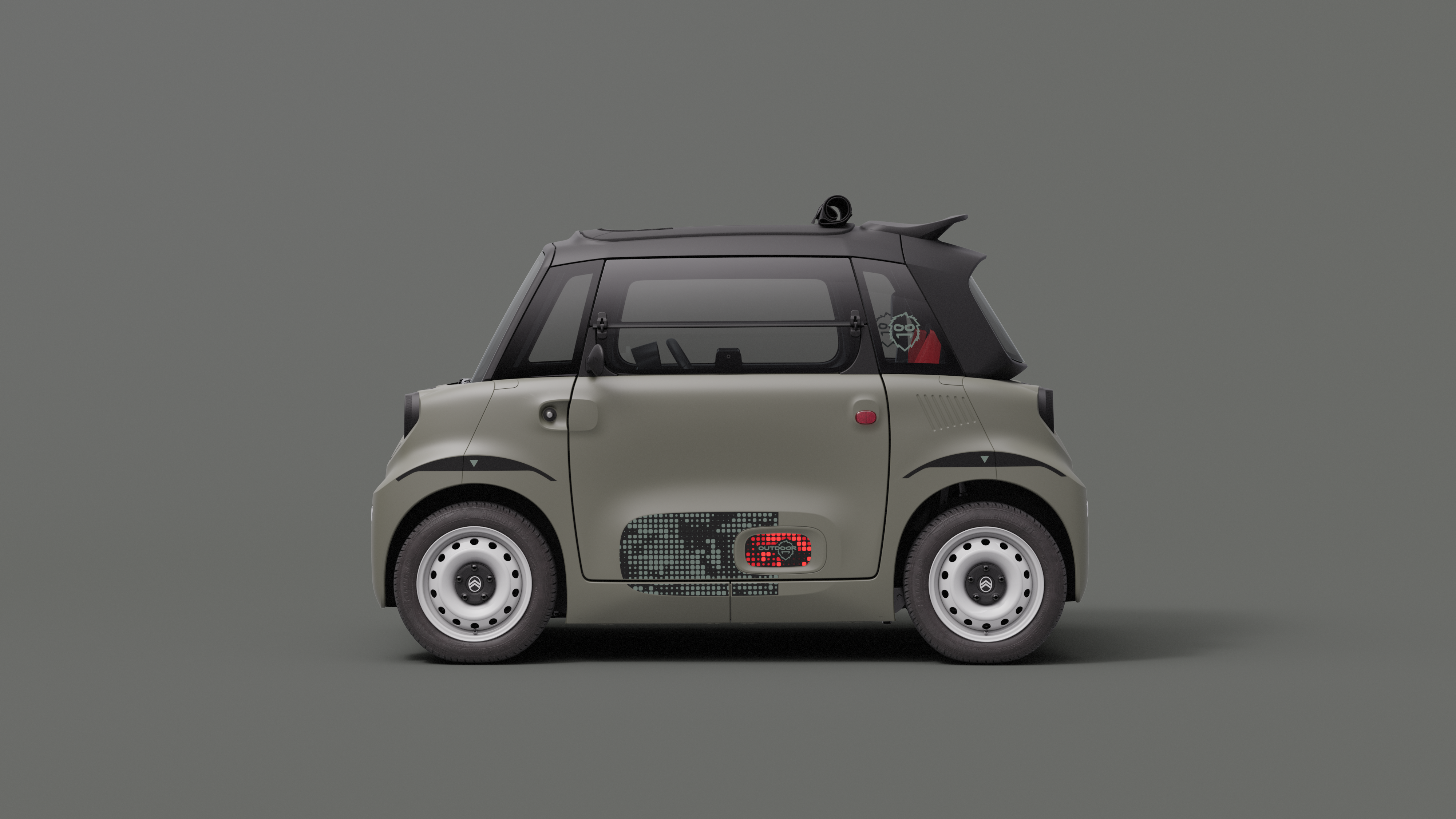 Zijaanzicht van de Citroën ami Outdoor met open dak: een uiterst compacte elektrische stadsauto die gemakkelijk te parkeren is