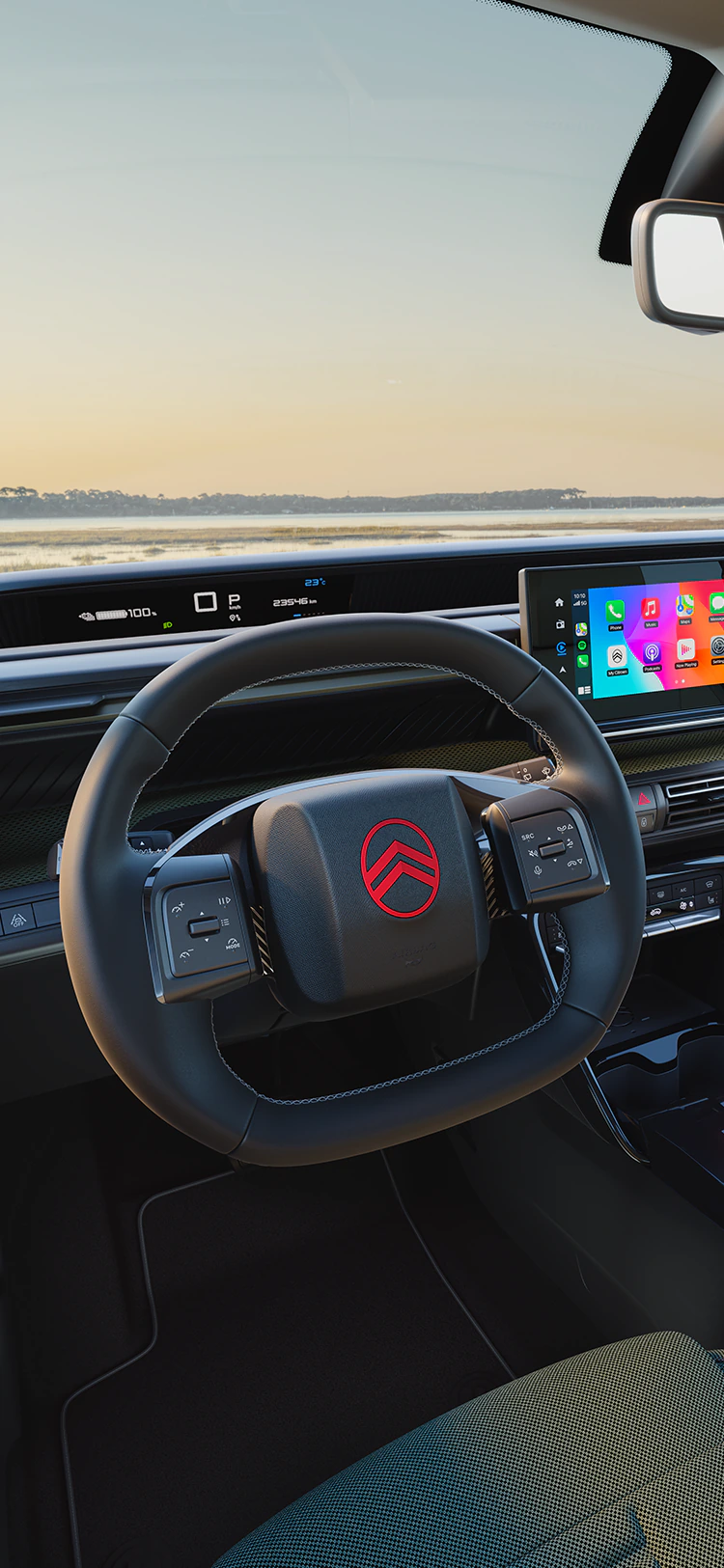 Driver view Citroën ëC3 Outdoor dashboard with infotainment screen shows Advanced Comfort connectivity for family SUV trips