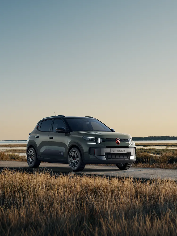 Front three-quarter view Citroën ëC3 Outdoor with LED signature shows Advanced Comfort SUV by coastal wetlands