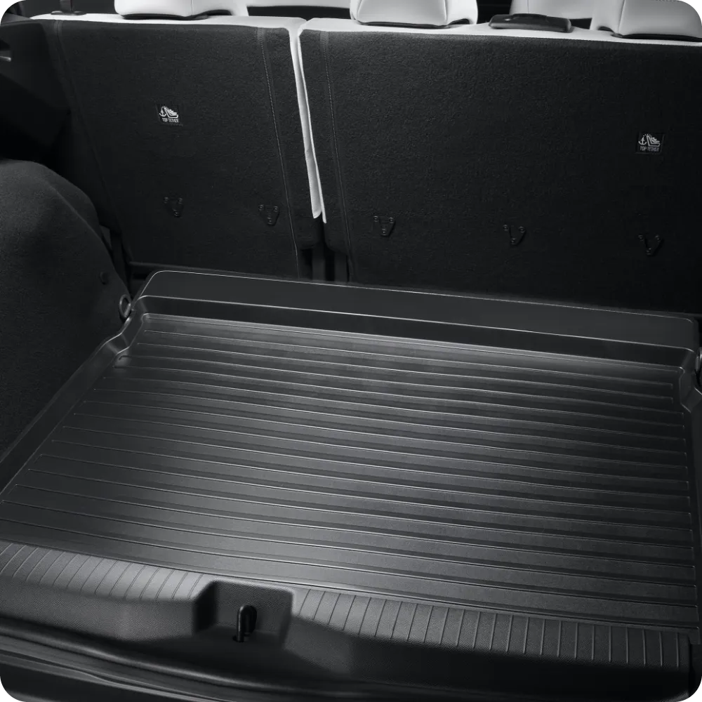 Close‑up van de bagageruimte van de Citroën ë‑C3 Aircross met beschermende bagageruimtebak voor duurzaam en betaalbaar dagelijks bagagebeheer.